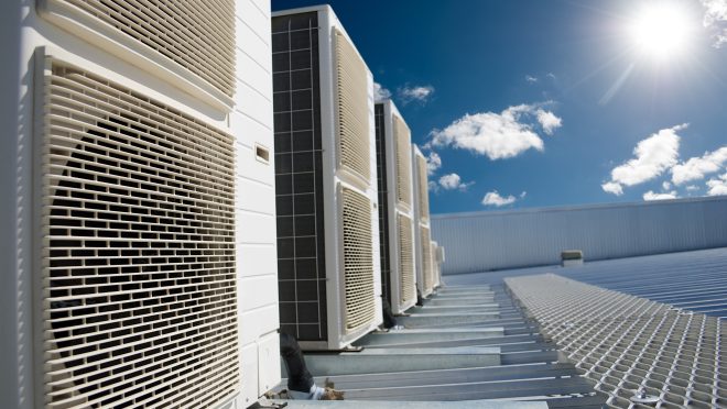 Air conditioner units with sun and blue sky