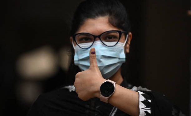 a-woman-shows-her-inked-finger-after-voting-in-bangladeshs-general-election-in-dhaka-on
