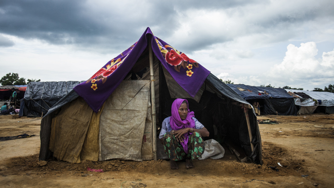 A helpless Rohingya refugee is sitting in front of a temporary camp in Cox’s Bazar. Photo: Salahuddin Ahmed/TBS