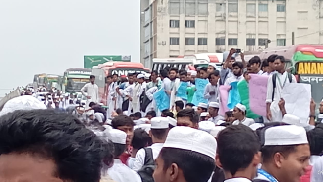Madrasah students staged a protest demanding justice for a student killed after being hit by a covered van today (9 August) in Tongi, Gazipur. Photo: TBS