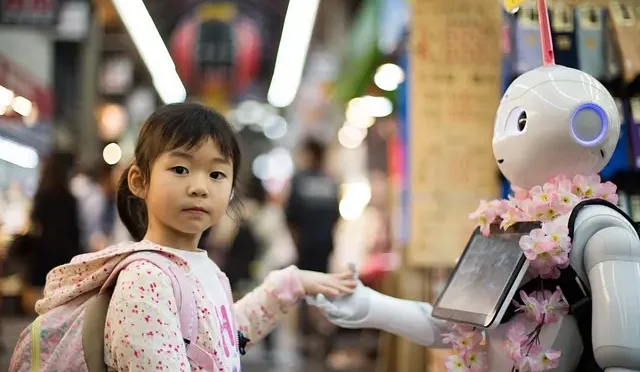 little-girl-holding-robots-hand