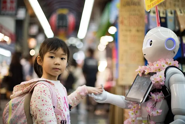 little-girl-holding-robots-hand