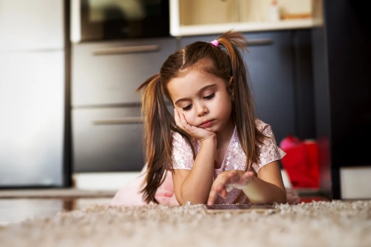 bored-little-girl-on-carpet