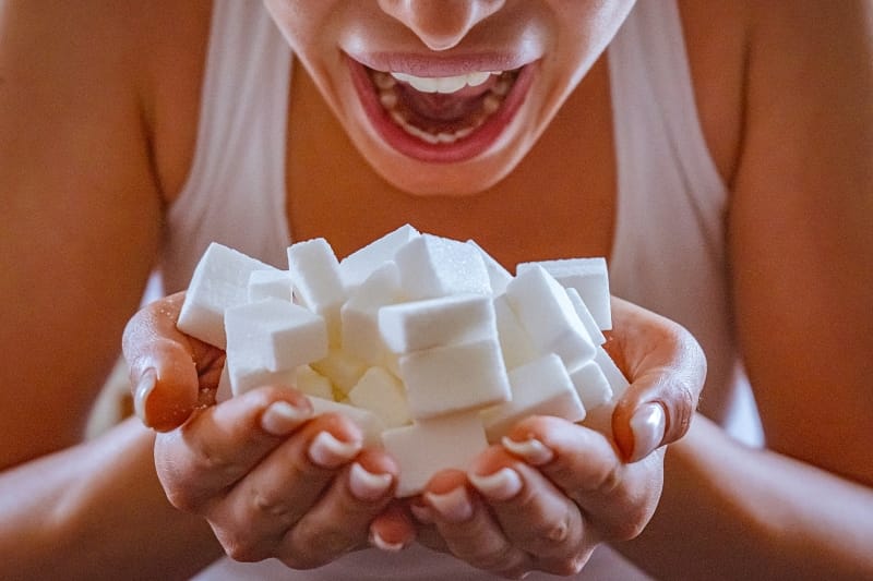 woman-handful-sugar-resized